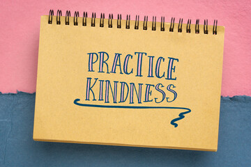 Fototapeta Practice kindness reminder - handwriting in a sketchbook against abstract paper landscape obraz