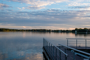 Obraz premium Sunset over the lake of a small Lithuanian town