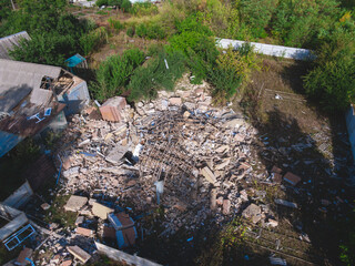Destroyed residential private house due to explosion. The collapse of a brick house, the collapse of the walls