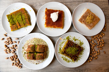 Table scene of assorted take out or delivery foods. Traditional Turkish cuisine. Various Turkish desert and cake. Top down view on a table.