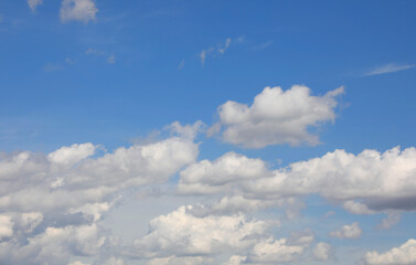 clear sky with white fluffy clouds  after the storm