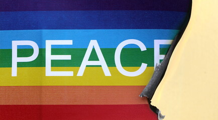 peace flag with the colors of the rainbow and the big text while burning with the flame on the...