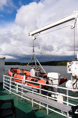A red inflatable lifeboat with motor on board a ferry in Turku Archipelago, Finland