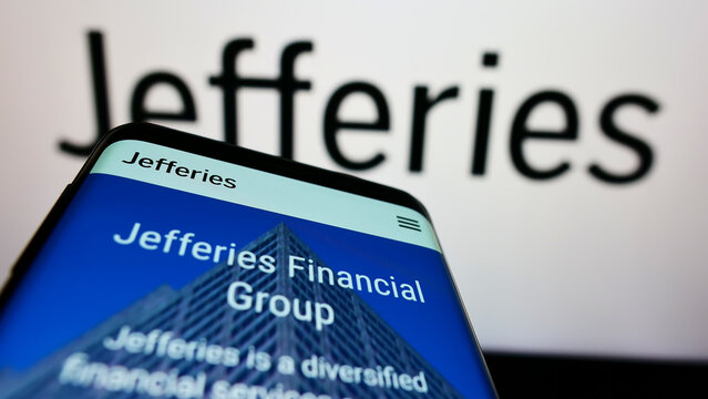 Stuttgart, Germany - 03-30-2022: Mobile phone with website of American company Jefferies Financial Group Inc on screen in front of logo. Focus on top-left of phone display.