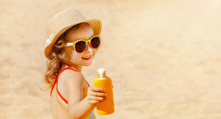 Safe protection from the sun. The child Is holding a Moisturizing Sunscreen in his hands.