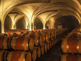 Bordeaux wine barrels in candlelight