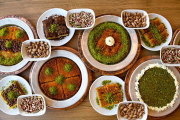 Table scene of assorted take out or delivery foods. Traditional Turkish cuisine. Various Turkish desert and cake. Top down view on a table.
