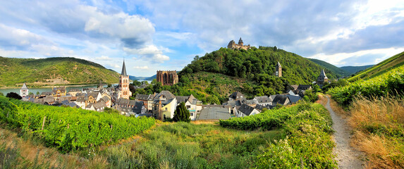 Panoramic view over the beautiful village Bacharach with castle and vineyards along the Rhine River, Germany - obrazy, fototapety, plakaty
