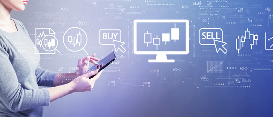 Stock trading theme with business woman using a tablet computer