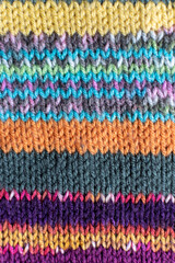 Obraz premium colourful knitting background backdrop with stripes in multi colour and rainbow 