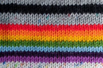 Obraz premium colourful knitting background backdrop with stripes in multi colour and rainbow 