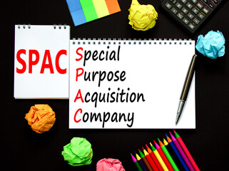SPAC special purpose acquisition company symbol. Concept words SPAC special purpose acquisition company on beautiful black background. Business SPAC special purpose acquisition company concept.