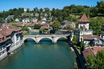 Fototapeta na wymiar Bern city in the Switzerland - bridge with river and old houses on the waterfront
