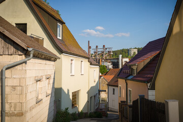 view over house rooftops decommissioned steel mill in sulzbach-rosenberg
