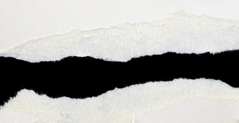 a white piece of paper on a black isolated background