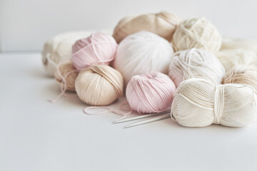 Obraz na płótnie Canvas Skeins of yarn, knitting needles, accessories for knitting. Handmade, hobby