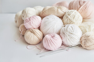 Obraz na płótnie Canvas Skeins of yarn, knitting needles, accessories for knitting. Handmade, hobby