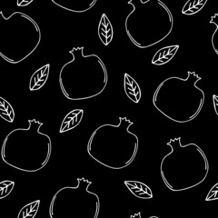 White pomegranate on black background. Pomegranates pattern. Seamless background with pomegranate fruits.