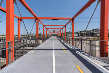 View of the new Taylor Yard bike path bridge spanning the Los Angeles River between Elysian Valley...