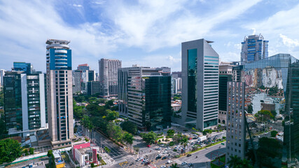 Fototapeta na wymiar Aerial view of Avenida Brigadeiro Faria Lima, Itaim Bibi. Iconic commercial buildings in the background. With mirrored glass
