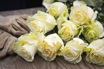 Fresh roses stacked on a table.