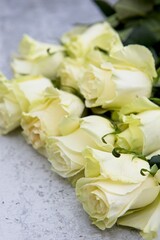Fresh yellow roses on a table.