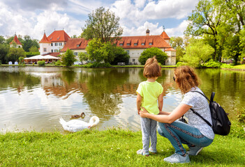 Young woman and kid at Blutenburg Castle, Munich, Germany, Europe