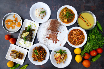 Traditional Turkish cuisine. Pizza, pita, pidesi, sucuk, hummus, kebab. Many dishes on the table. Serving dishes in restaurant. Background image. Top view, flat lay