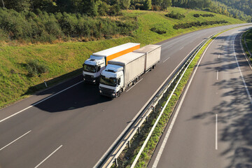 Landscape with a moving truck on the highway.