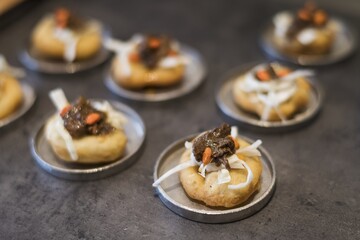Preparing dinner. Boar, sea buckthorn, sauerkraut, crawfish, plate. Table, close-up, dining, background, lighting, people. Beautiful surroundings, adventure restaurant.