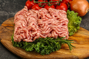 Raw pork minced meat over board