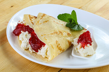 Pancake with cottage cheese and jam