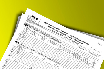 Form 965-B documentation published IRS USA 43842. American tax document on colored