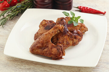 Roasted chicken wings with spicy sauce
