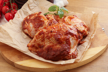 Marinated chicken leg in tomato sauce