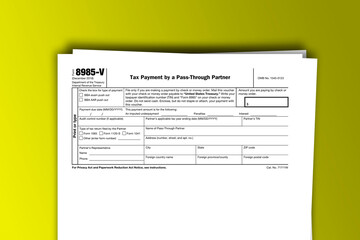 Form 8985-V documentation published IRS USA 12.23.2019. American tax document on colored