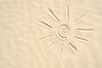 Fototapeta na wymiar Sun drawn on the sand with copy space,Summer concept