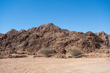 Sharm el Sheikh, Sinai peninsula. Mountains landscape on background. Quadricycle safari park in Egypt sand desert.