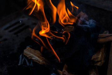 Close up shot of burning wood and charcoal used for barbeque