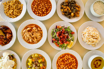 Table scene of assorted take out or delivery foods. Traditional Turkish cuisine. Various Turkish meal and appetizers. Top down view on a table.