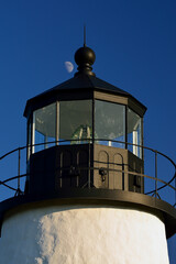 Fototapeta na wymiar Moonrise over the Pemaquid Lighthouse on the Maine Coast