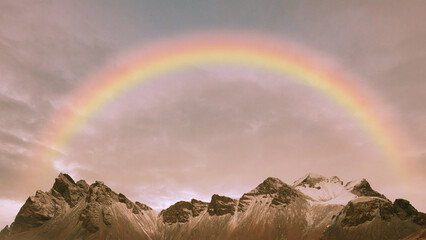 rainbow in the sky over the mountains