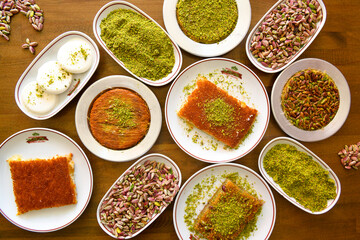 Table scene of assorted take out or delivery foods. Traditional Turkish cuisine. Various Turkish desert and cake. Top down view on a table.