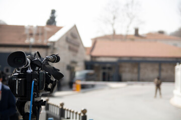 News camera waiting for the result from inside