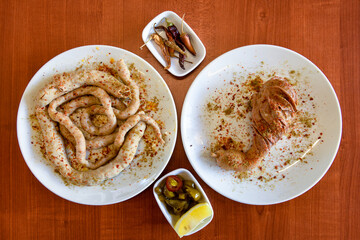 Traditional Turkish cuisine. Pizza, pita, pidesi, sucuk, hummus, kebab. Many dishes on the table. Serving dishes in restaurant. Background image. Top view, flat lay