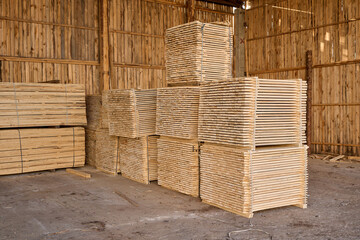 Boards sawn. The saw cut tree is folded. Stacks of plywood. Wood transportation.