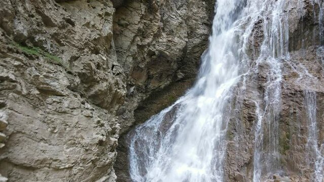 Margaret Falls flowing down a steep, rocky cliff in the stunning Herald Provincial Park in British Columbia, Canada. Aerial shot 
