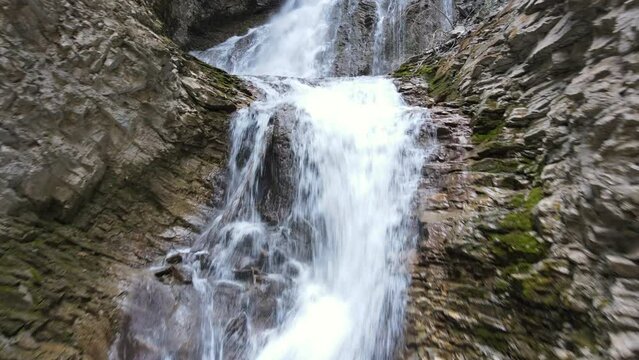 Beautiful Margaret Falls cascading down over a rocky cliff face in Herald Provincial Park in British Columbia, Canada. Aerial shot 