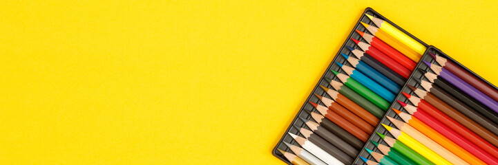 Education, students use colored pencils to draw pictures at the library.