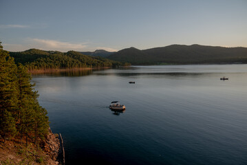 lake in the mountains with boats